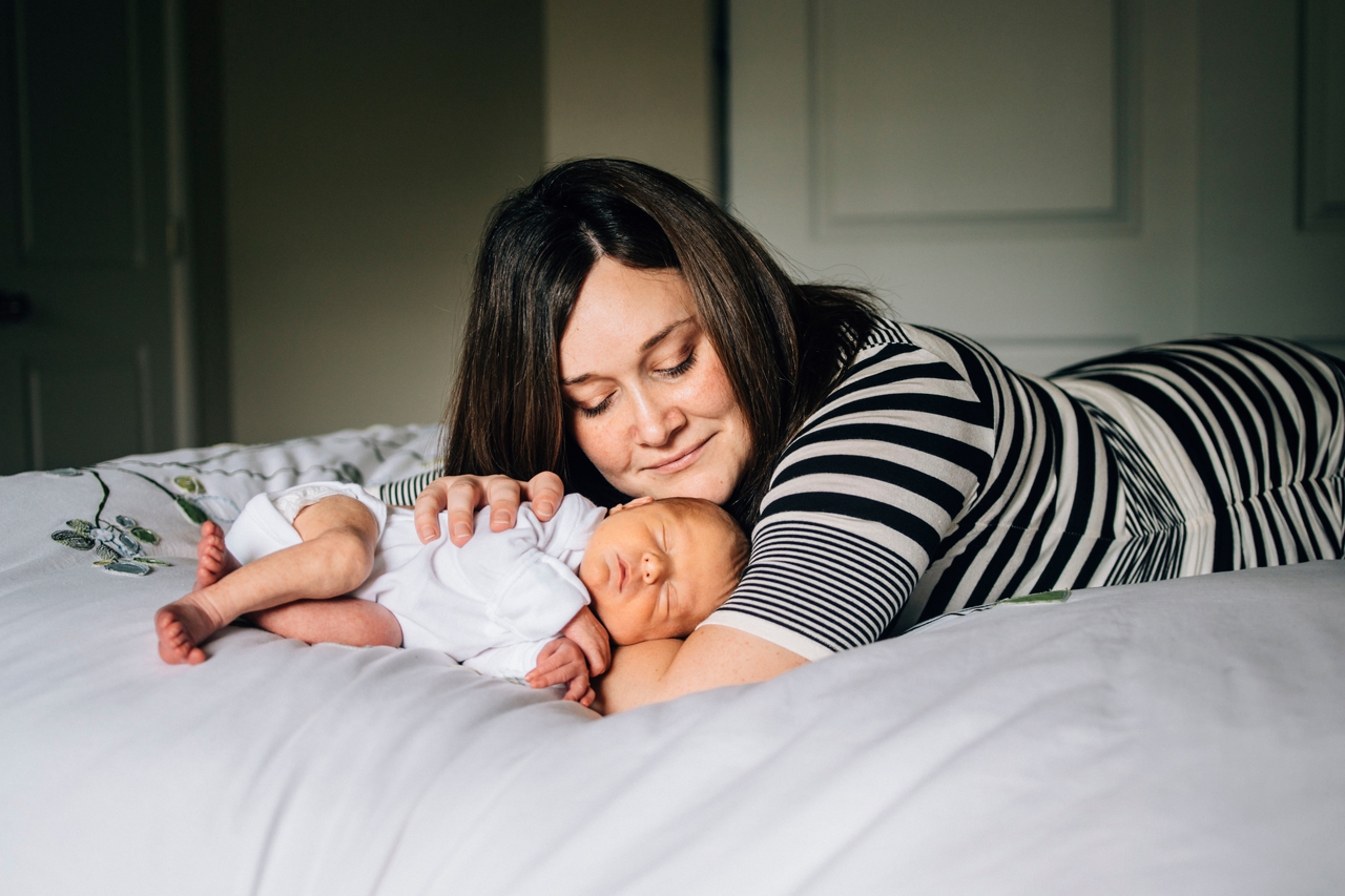 mom relaxes with baby